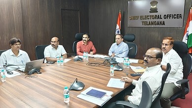Officials seated around a conference table in a Telangana Chief Electoral Office meeting room.