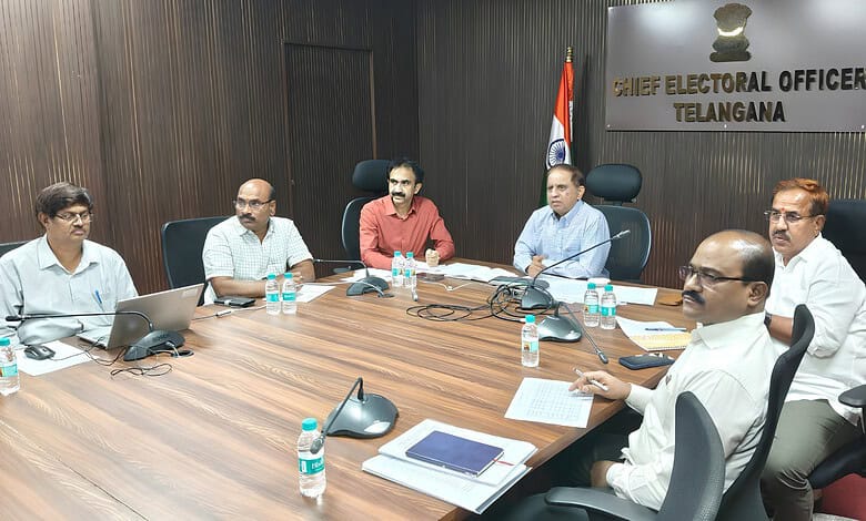 Officials seated around a conference table in a Telangana Chief Electoral Office meeting room.